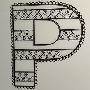 “P” metal wall hanging.